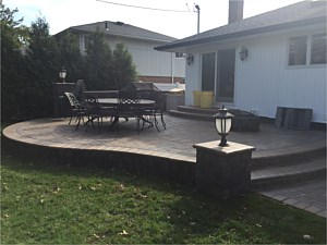 cambridge pavers toffee onyx ledgestone raised patio light pier column step up elevated patio
